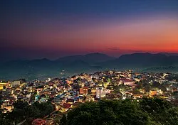 Hilltop view of Tansen town surrounded by green hills in Palpa in the evening.