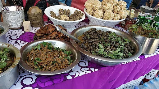 Tharu culture cuisine including ghonghi and Sidhra(dry fish) during Maghi Festival