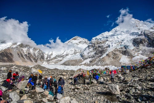 Trekkers on the way to the Everest Base Camp with the view of Mount Everest in the Background